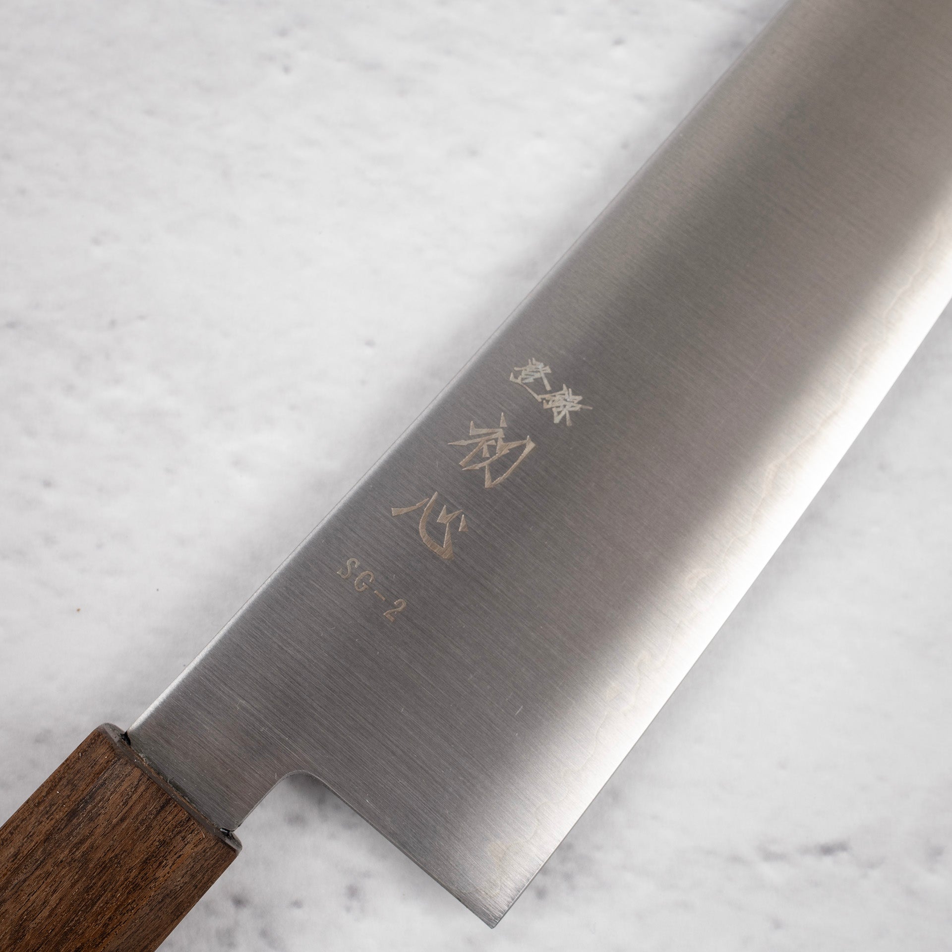 HatsukokoroHayabusaSG2MigakiK-tipGyuto210mmc.jpg Hatsukokoro Hayabusa SG2 Migaki K-tip Gyuto 210mm, view 3