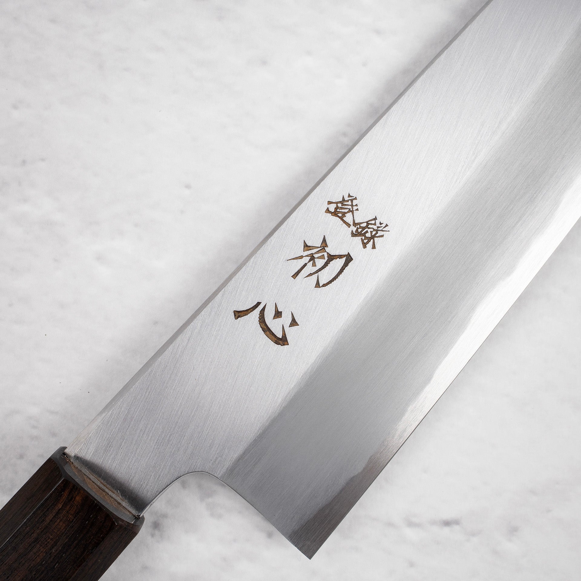 NakagawaBlue1KasumiBunka180mmEbonyHandlec.jpg Nakagawa Blue1 Wide Bevel Kasumi Bunka 180mm Ebony Handle, view 3