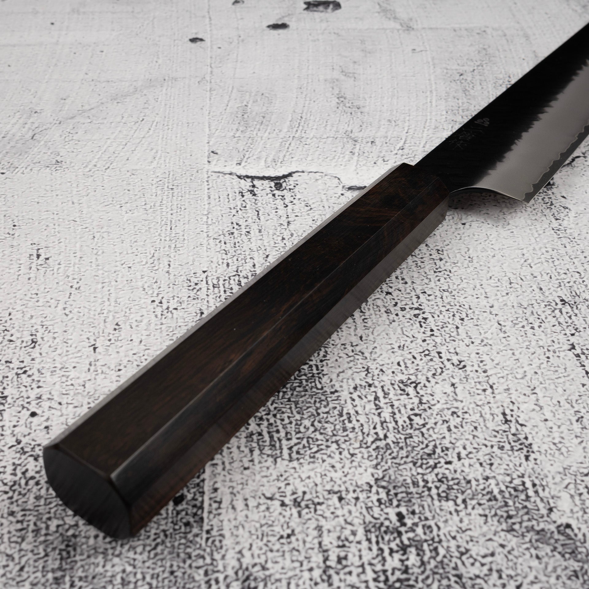 NigaraSG2KurouchiTsuchimeSujihiki240mmEbonyHandlee.jpg Nigara SG2 Kurouchi Tsuchime Sujihiki 240mm Ebony Handle, view 4
